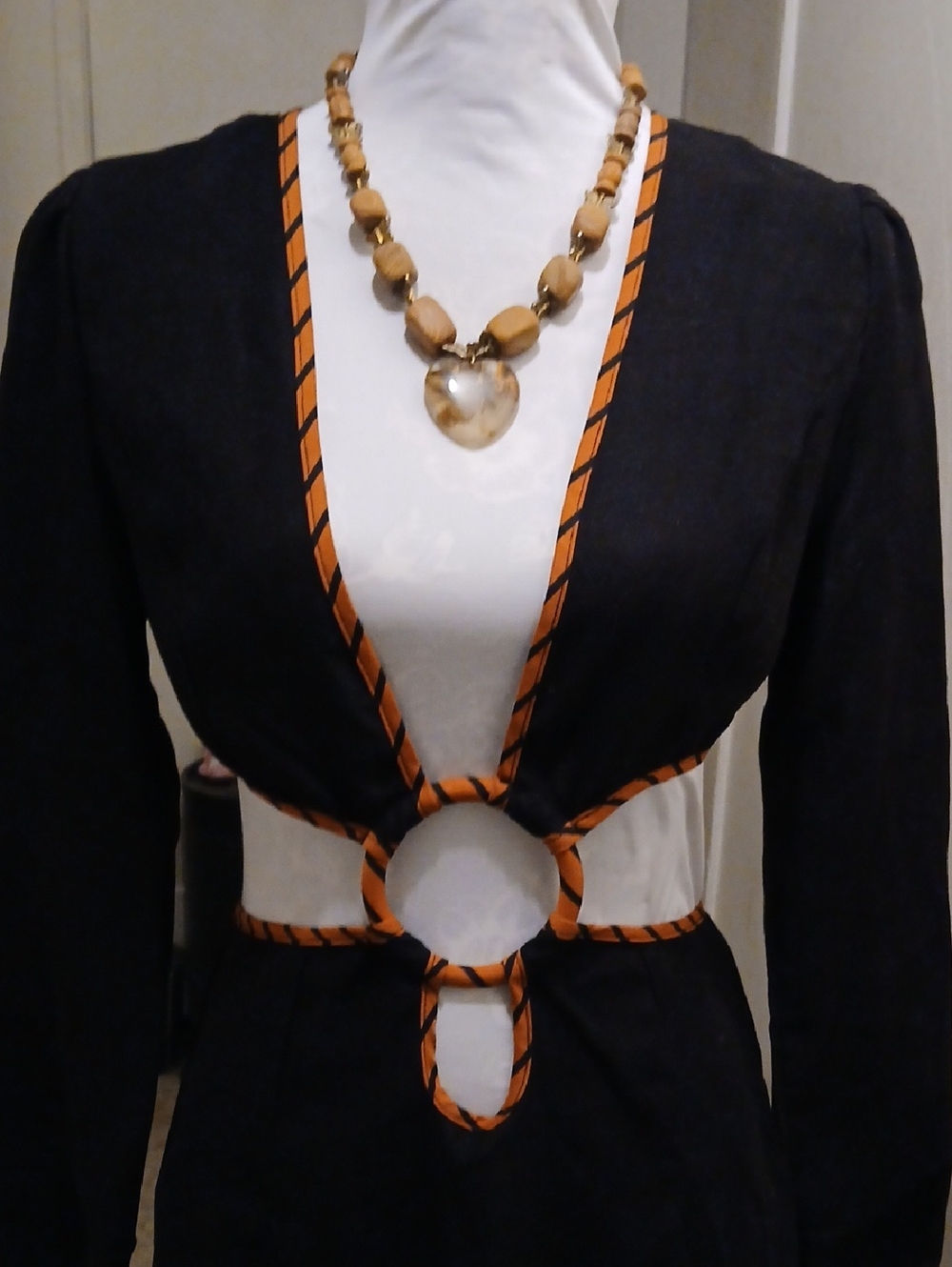 Black Dress with Orange Trim and Ring Waist Detail